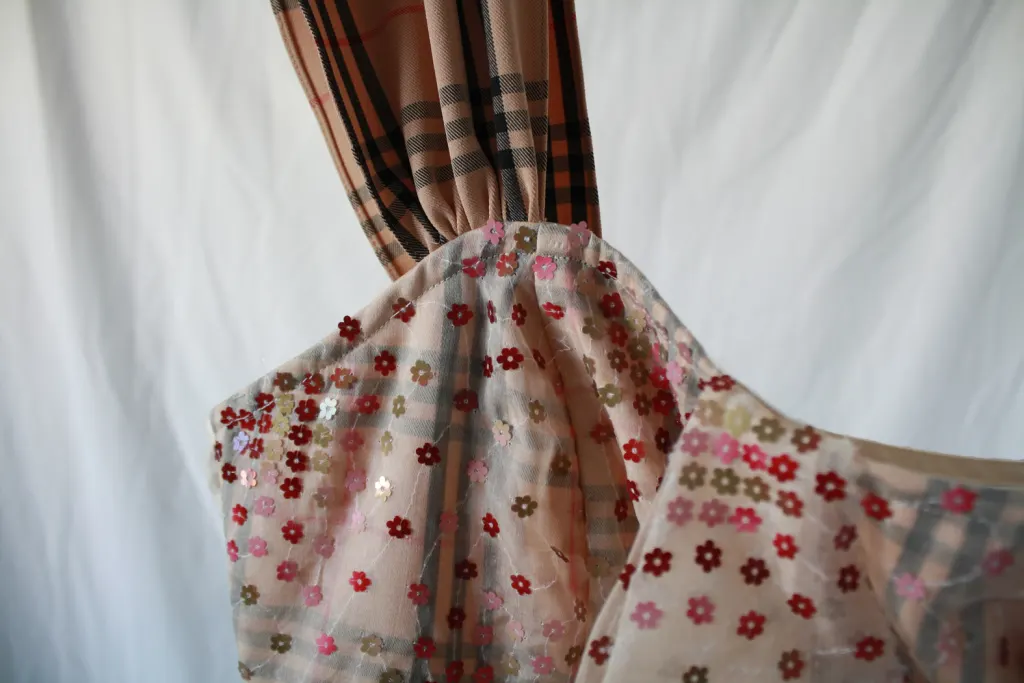 Close up of the finishing of this nova check plaid one shoulder bustier dress