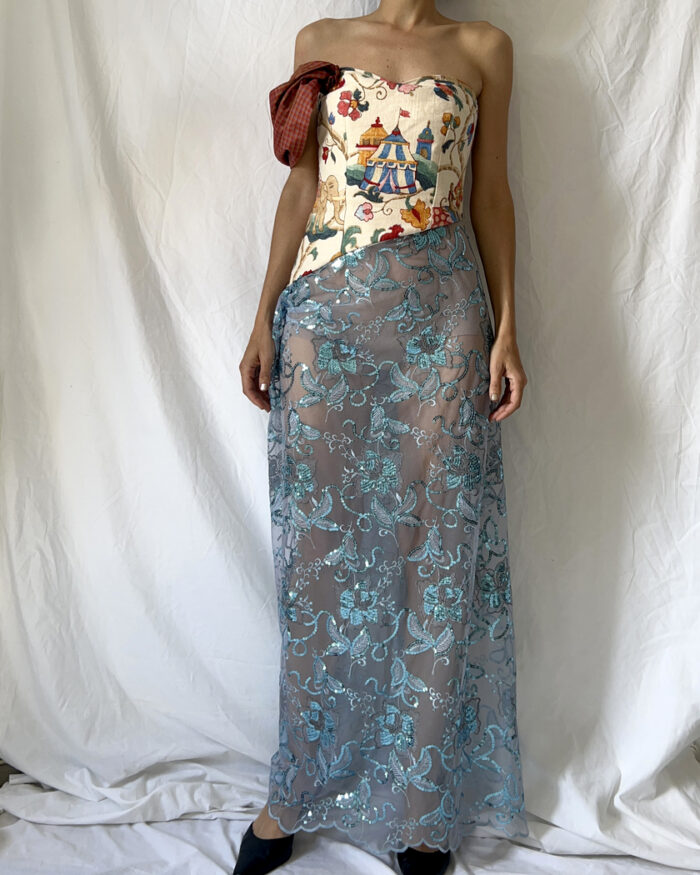 Front of this tapestry bustier sequined sheer dress with one sleeve
