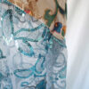 Close up of the the different fabric's textures like sheer sequined fabric, vintage tapestry and taffeta fabric