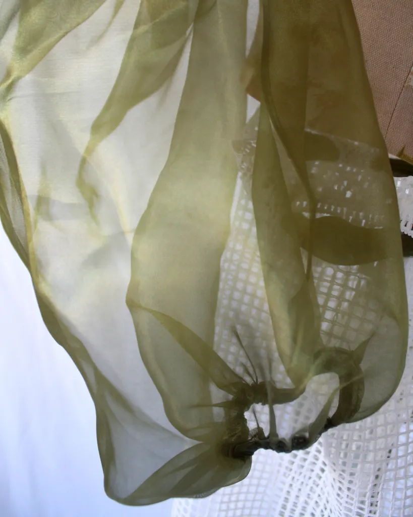 Close up of the sheer bouffant sleeve of this tapestry bustier curtain dress