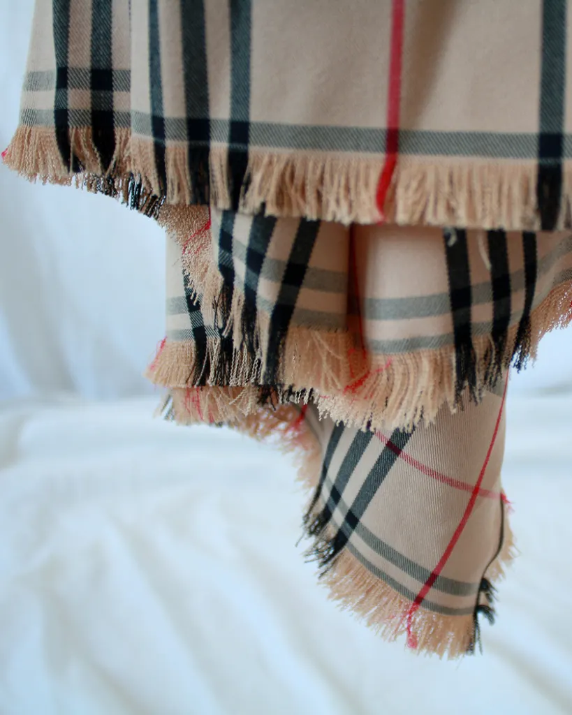 Detail of the ruffle hem of this plaid nova check dress