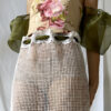 Close up of the front of this vintage bustier tapestry dress with curtain skirt and bouffant sheer sleeves