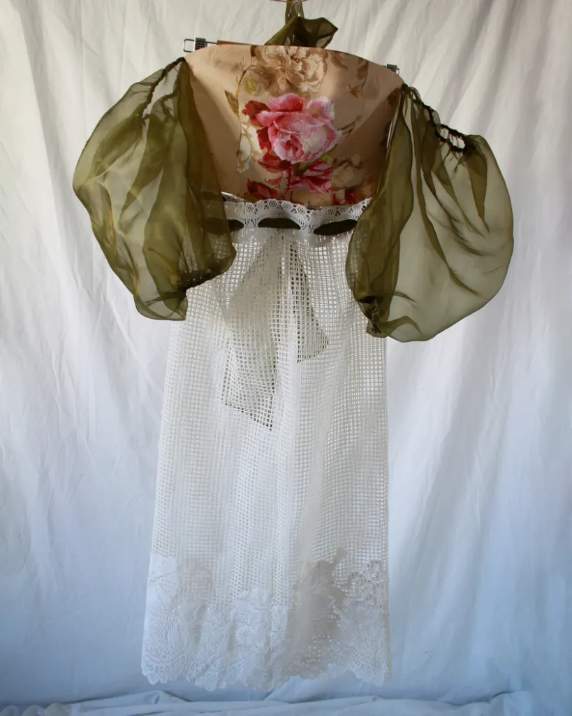 Front of this vintage bustier tapestry dress with curtain skirt and bouffant sheer sleeves