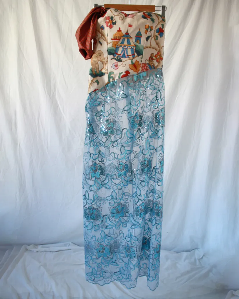 Front of this tapestry bustier sequined sheer dress with one sleeve
