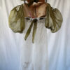 Back of this vintage bustier tapestry dress with curtain skirt and bouffant sheer sleeves
