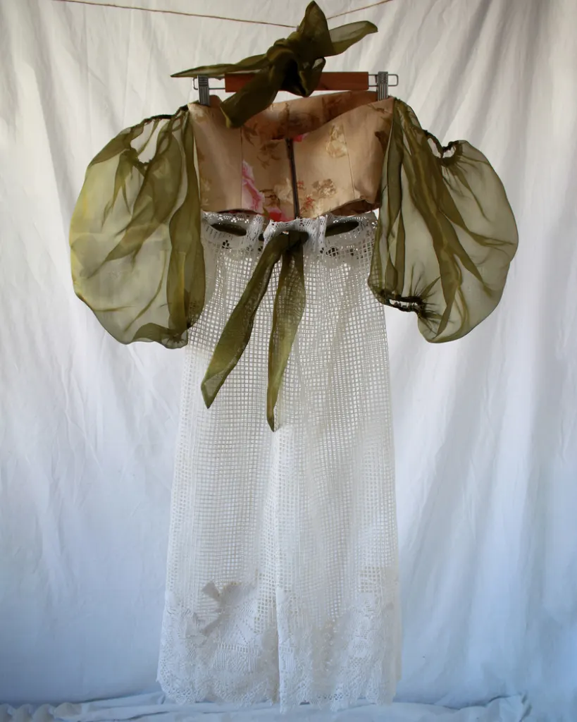 Back of this vintage bustier tapestry dress with curtain skirt and bouffant sheer sleeves