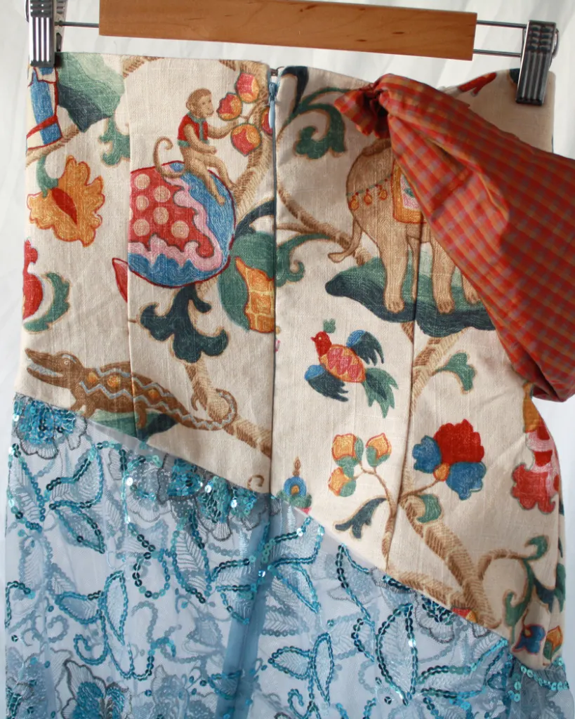 Close up of the the different fabric's textures like sheer sequined fabric, vintage tapestry and taffeta fabric