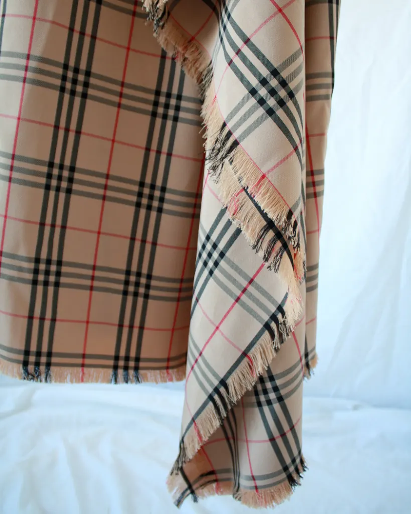 Detail of the ruffle hem of this plaid nova check dress