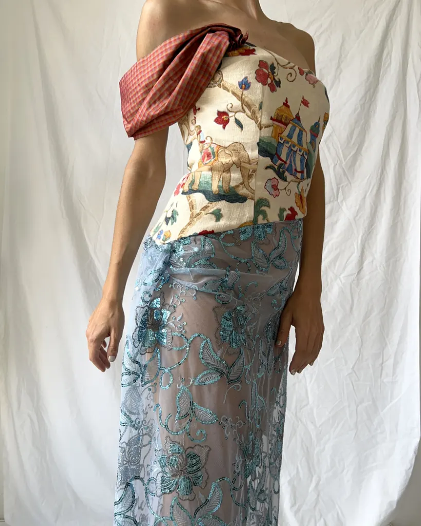 Close up of the the different fabric's textures like sheer sequined fabric, vintage tapestry and taffeta fabric